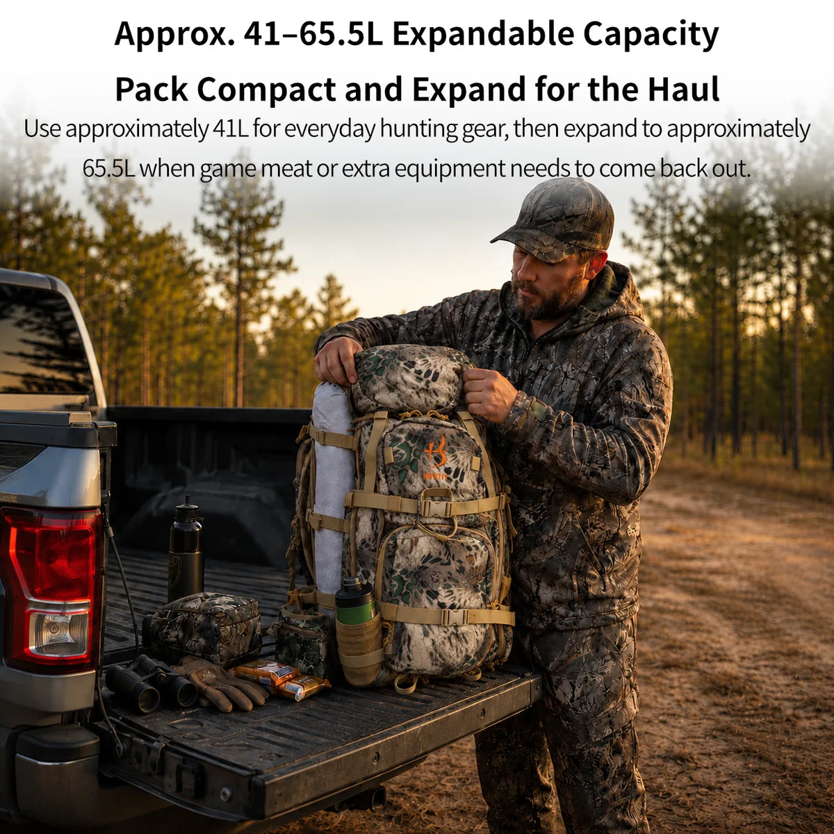 A man in camouflage clothing stands in the bed of a pickup truck at sunset, loading an expandable hunting backpack. White text at the top explains the pack's capacity: approximately 41-65.