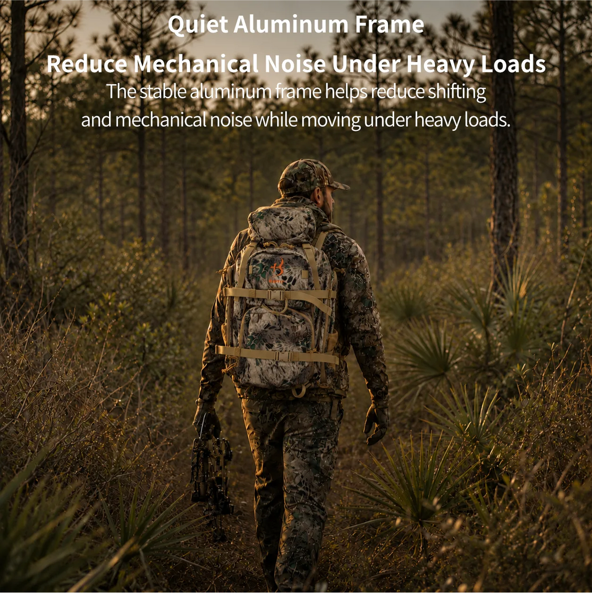 A person in camouflage clothing and a large backpack walks through a wooded outdoor setting. White text at the top reads, 'Quiet Frame & Quiet 800D Hunting Fabric Move Through Brush with Less Noise' and describes reducing mechanical noise against branches and gear.
