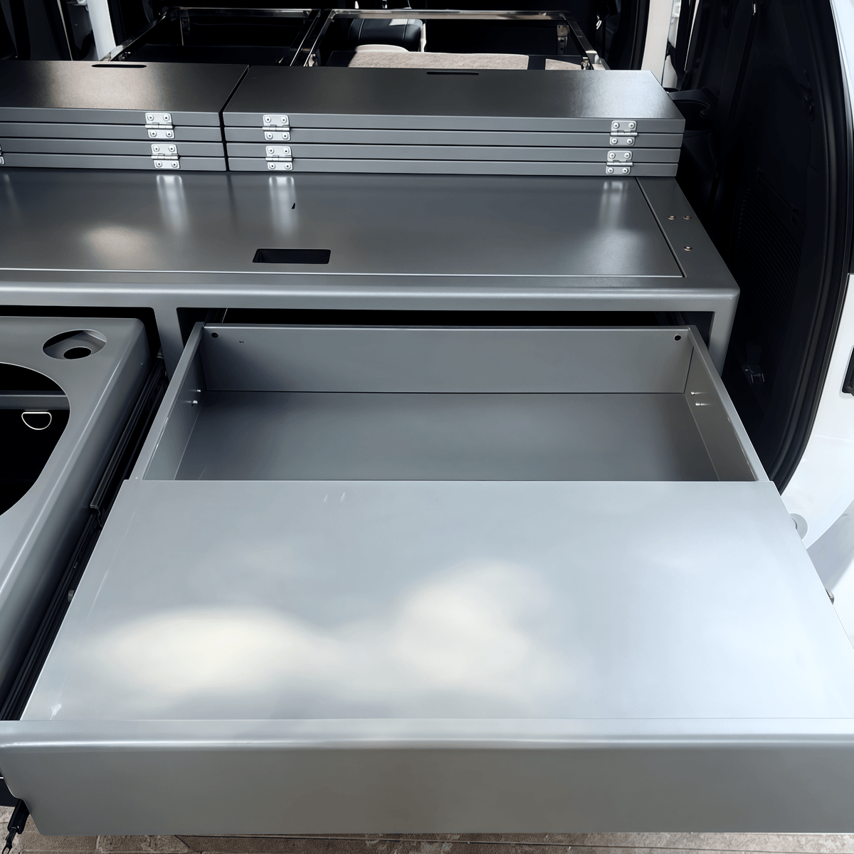 SUV drawer system showing smooth pull-out mechanism and interior gear storage