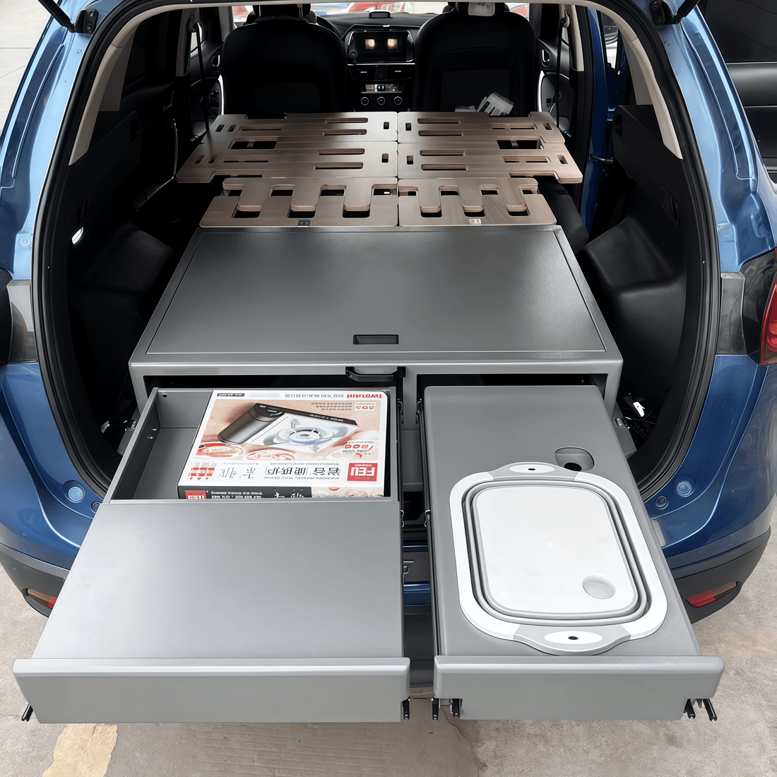 Professional SUV drawer system installed inside vehicle cabin with gear organization