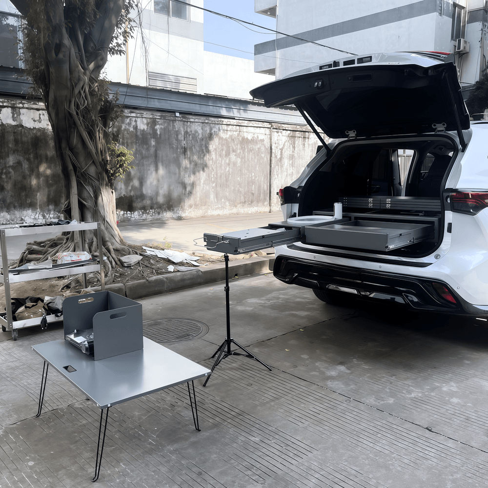 Overland drawer system with pull-out table and kitchen setup for SUV camping