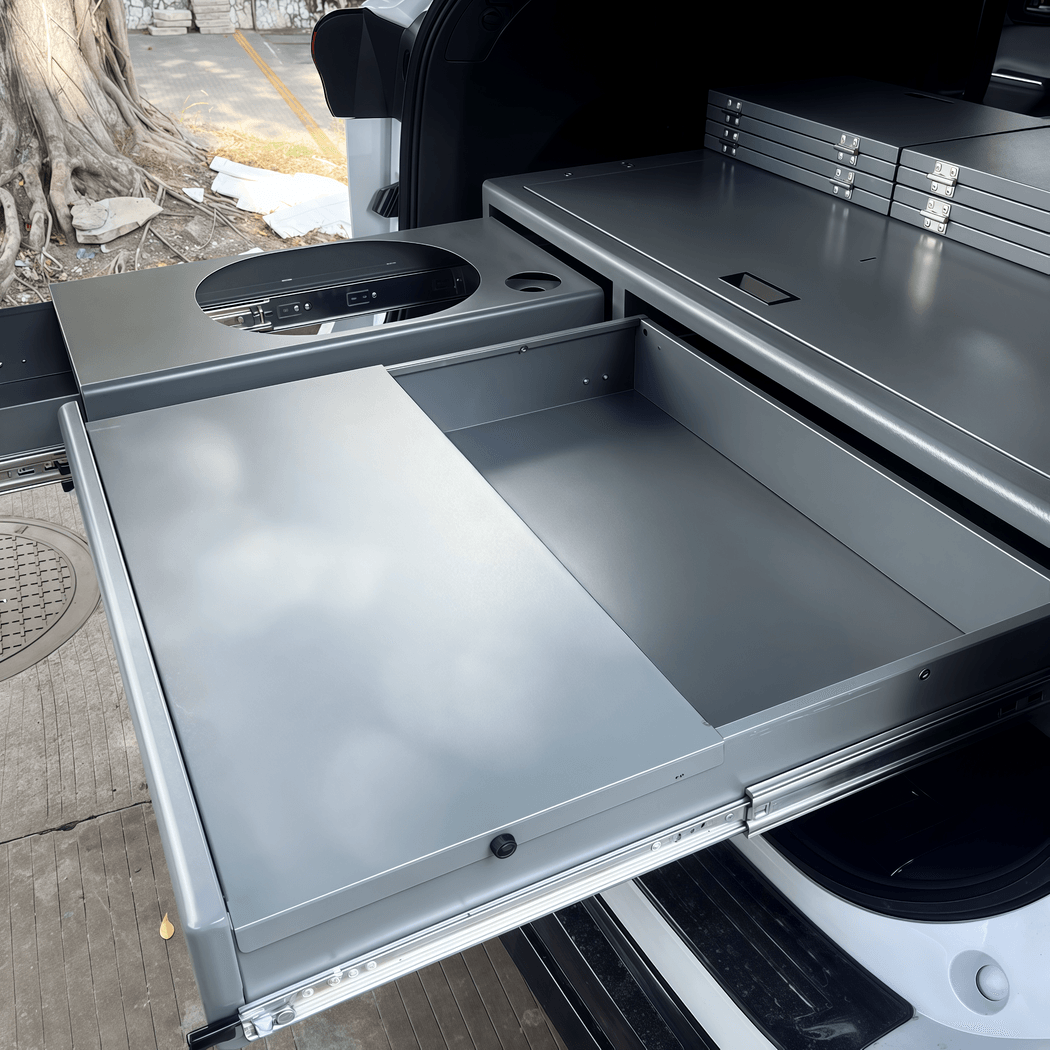 Heavy-duty drawer system for SUV interior showing slide-out storage functionality